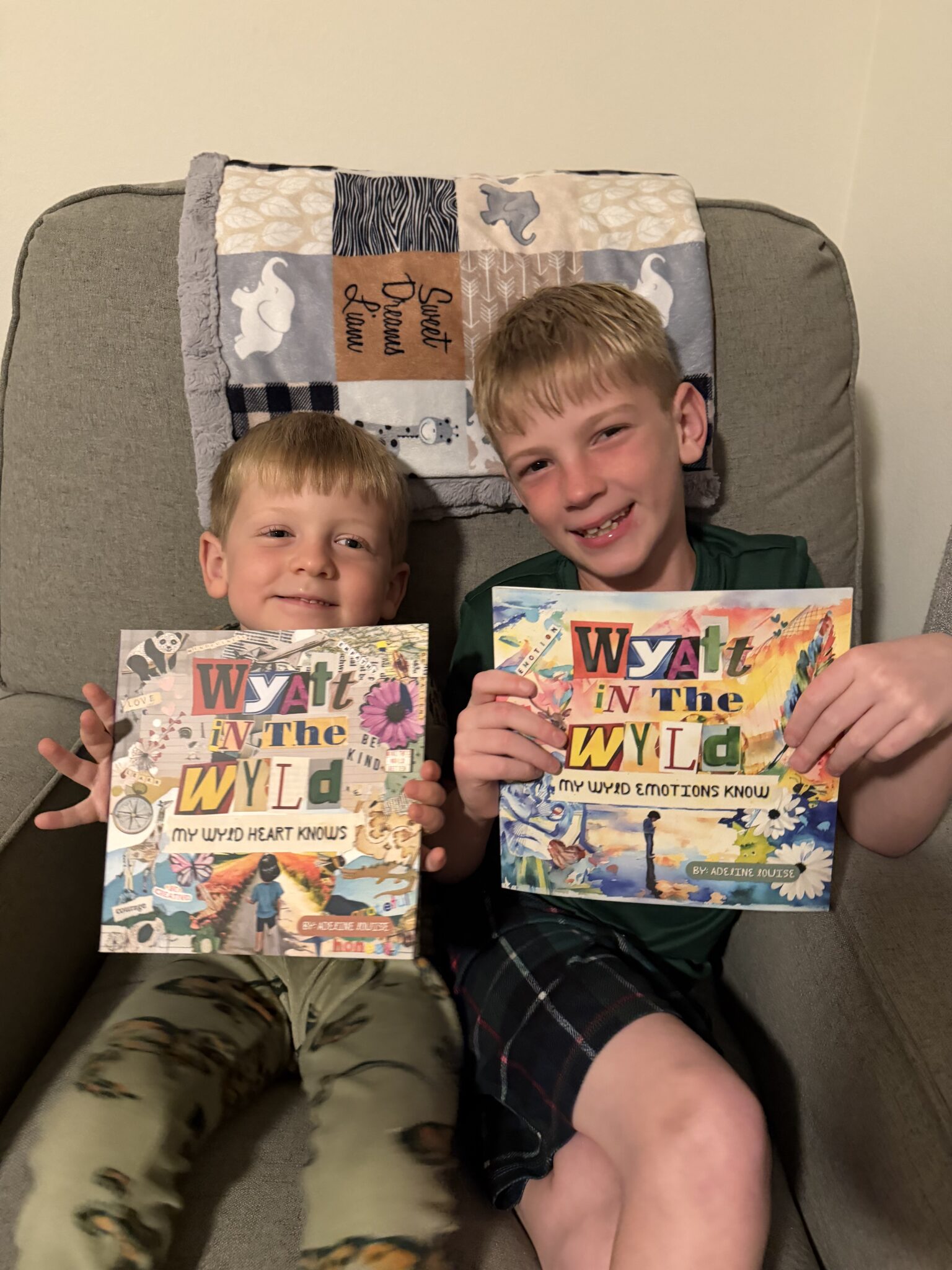 wyld heart and wyld emotions books being held by two boys